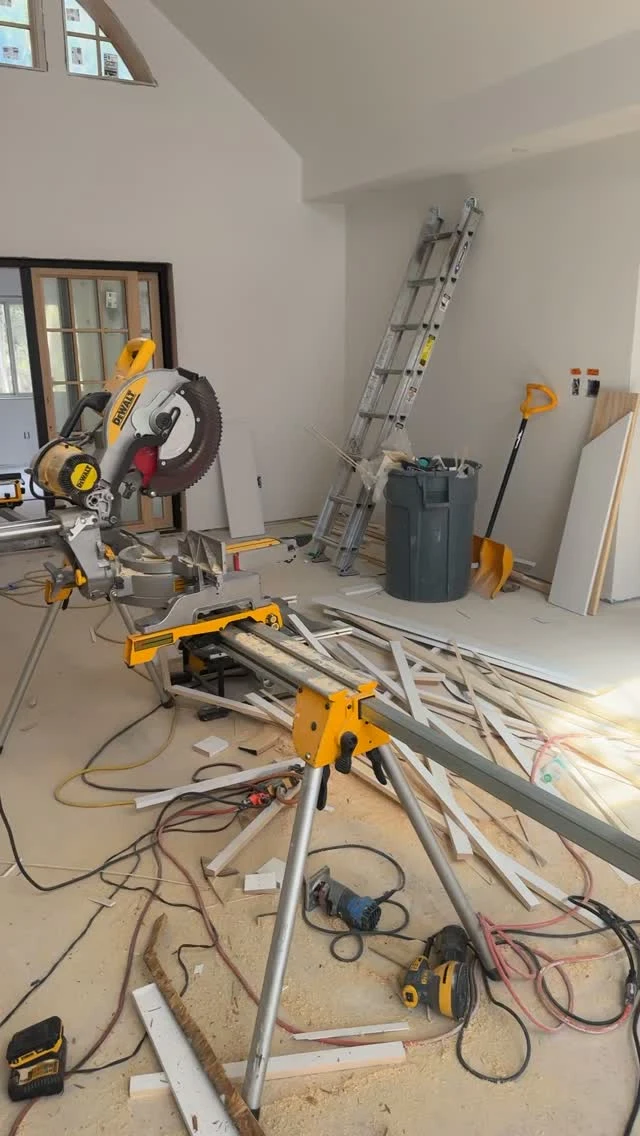 TH Finish Carpentry Instagram photograph of tools and a miter saw in an interior under construction